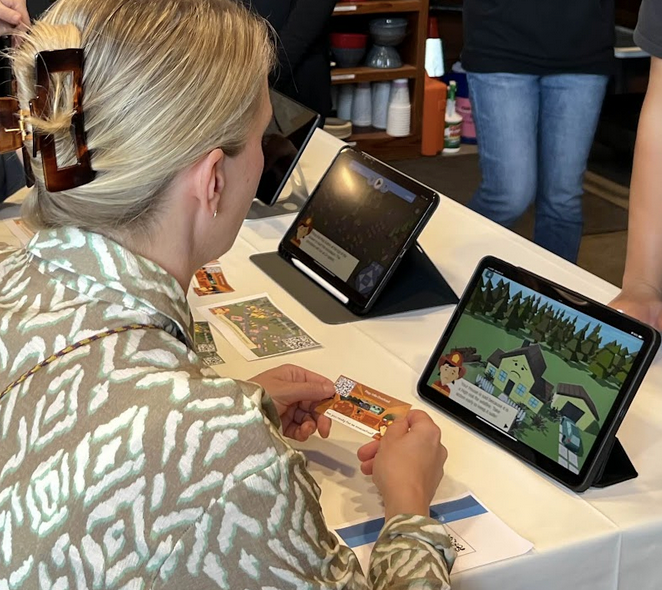 Woman plays home hardening game on a tablet